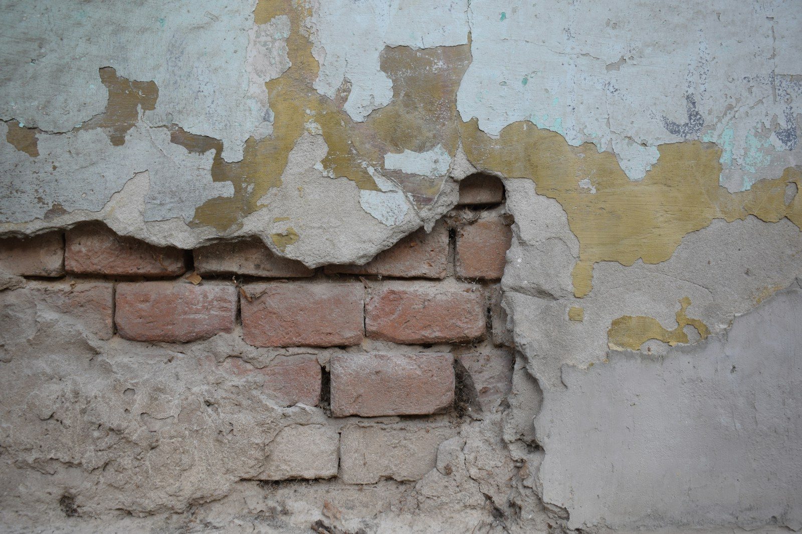 a brick wall with a crack in it